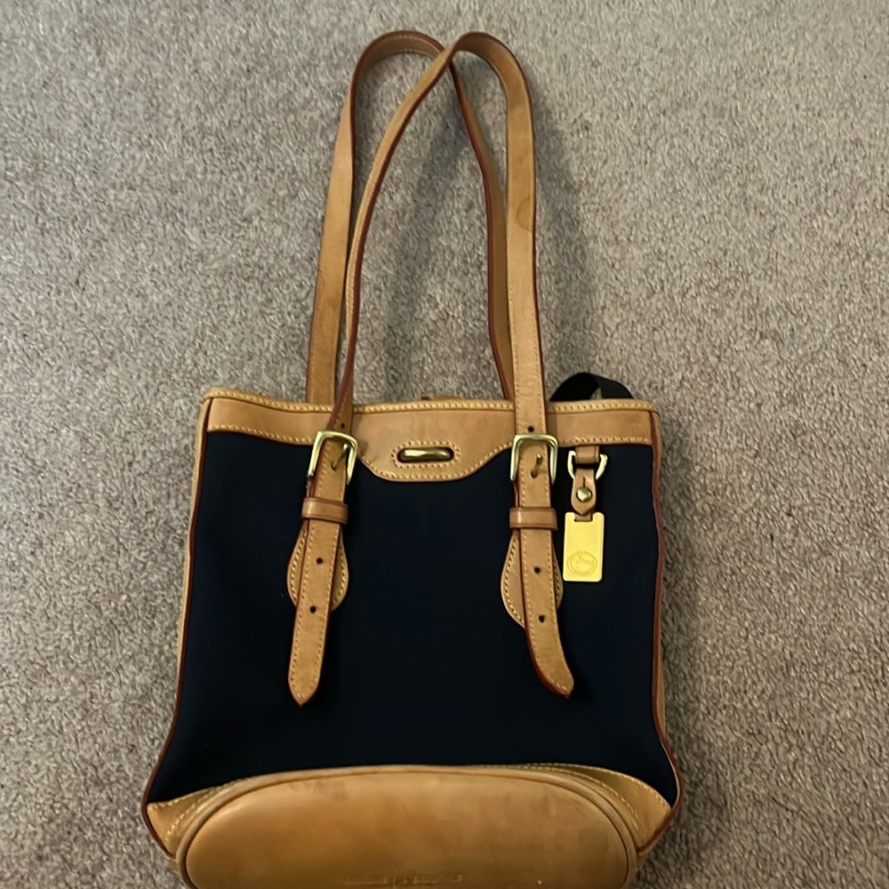 Dooney & Bourke medium size bag..  over the shoulder (adjustable)